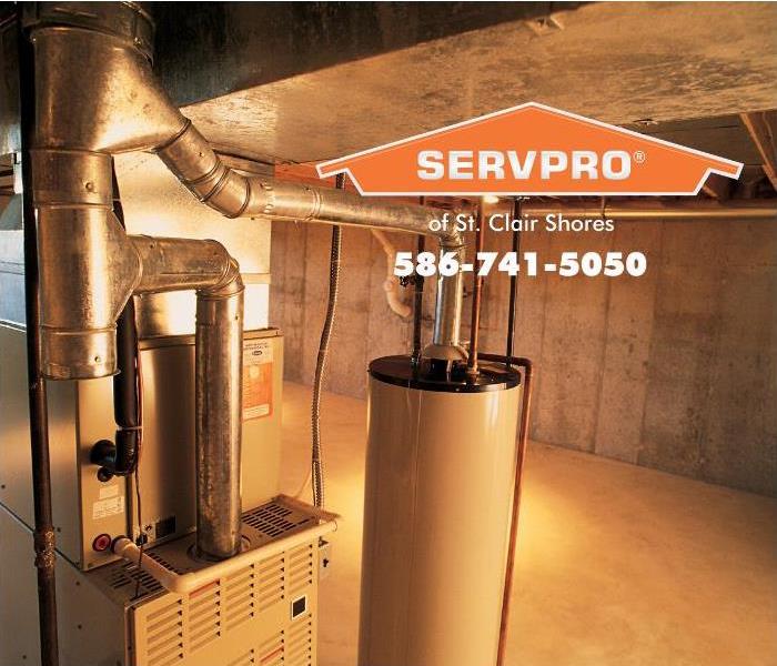A hot water heater is shown installed in a basement. 