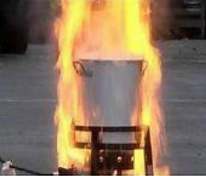 Deep fryer outdoors with flames shooting up