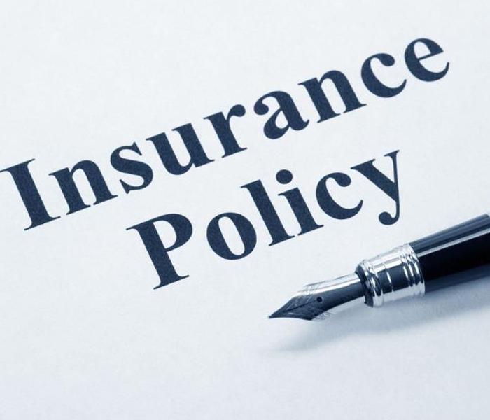 Insurance policy with fountain pen on top